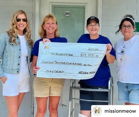 For the Love of a Paw's Mission Meow grant check presentation
