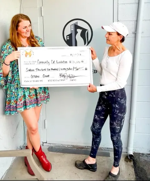 Community Cat Foundation receiving its Mission Meow check